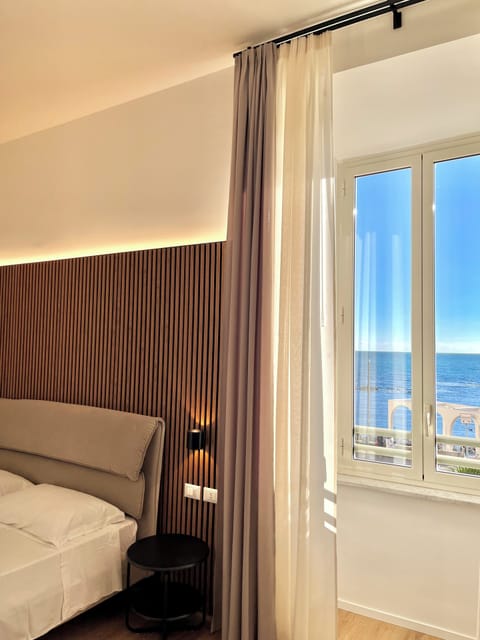 Deluxe Triple Room, Sea View | Desk, laptop workspace, free WiFi