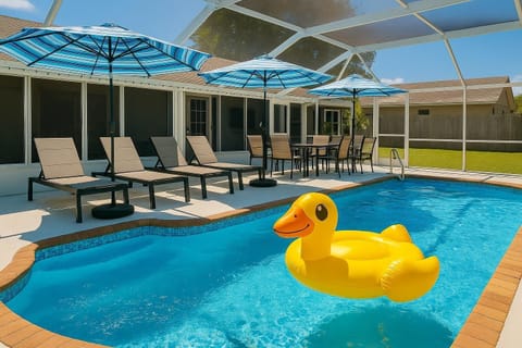Sunlit poolside retreat with loungers and umbrellas