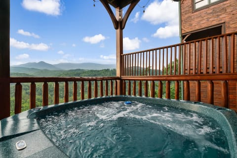Relax in the hot tub and enjoy the stunning mountain scenery at Mountain Rendezvous in Gatlinburg!