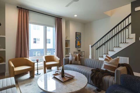Stylish living room with modern decor and natural light.
