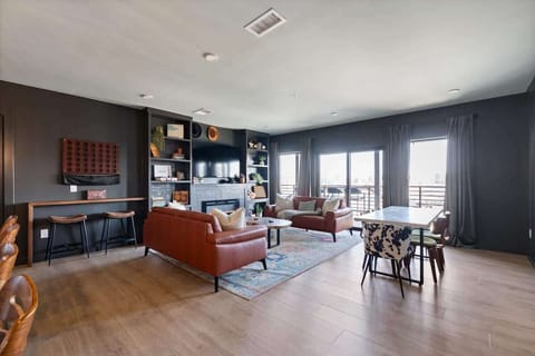 Enjoy the View from this Bright Living Room with Fireplace