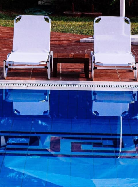 Seasonal outdoor pool, open 11:00 AM to 7:00 PM, pool umbrellas