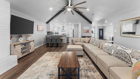 Welcome to your cozy retreat! This spacious living room boasts a large table perfect for meals and games, plus a comfy couch for relaxation. Whether you're chilling solo or hosting friends, this is the ultimate hangout spot! 🌟 