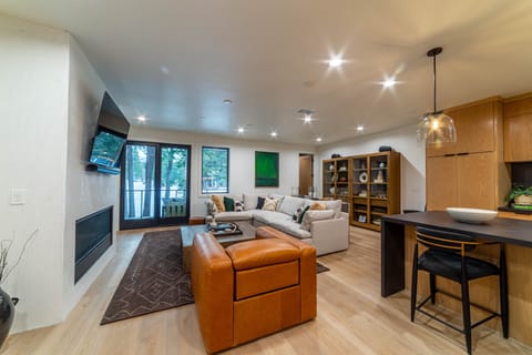 Bright, open, living room overlooking the Sierra Star Golf Course and pine tree forest.