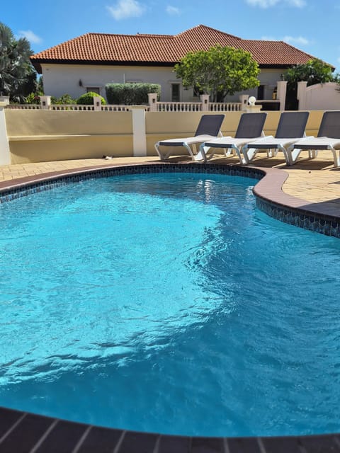 Unwind after the beach at the pool, located steps away from your unit. 