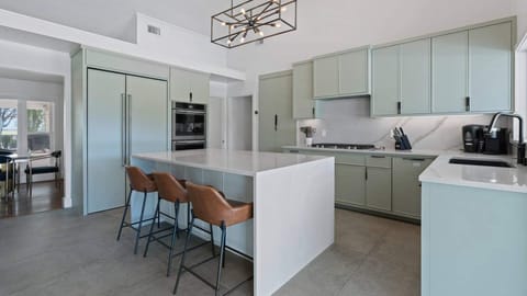 Contemporary chef's kitchen with centered island