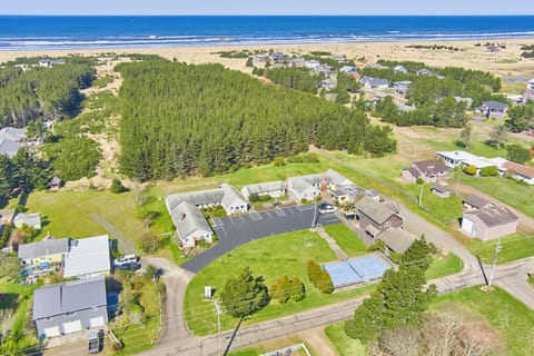 Aerial view highlighting the cottage’s close proximity to the beach—just a short stroll away!