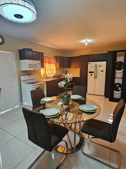Indoor dining,  oven/stovetop, laundry, microwave, refrigerator, kitchen visible