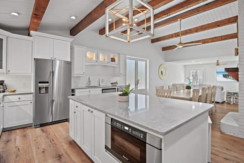 GOURMET, FULLY-STOCKED KITCHEN: Cook in style with upscale appliances, custom cabinetry, and multiple refrigerators in the Fully Remodeled Kitchen