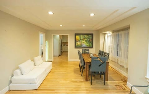 The juxtaposed dining area behind the living room.