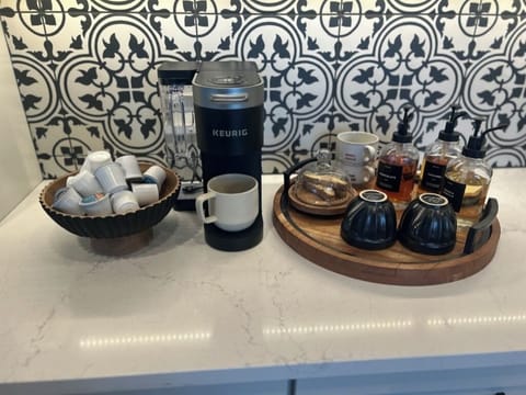 Coffee bar with Keurig pods and syrup for your enjoyment.