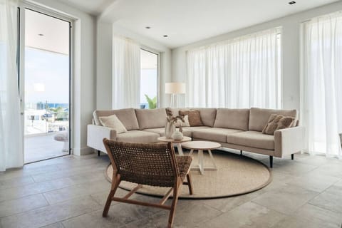 This living room is so inviting! The cozy sectional and bright natural light create the perfect spot to relax and enjoy the view.