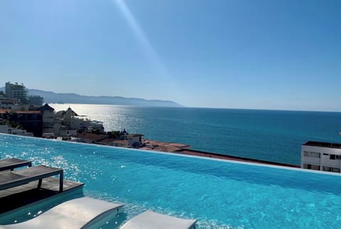 The rooftop pool offers stunning views of the Bay of Banderas.