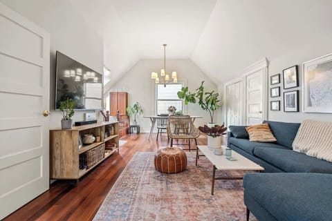 Bright living room with stylish seating and hardwood floors.