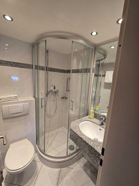 Shower, towels, toilet paper