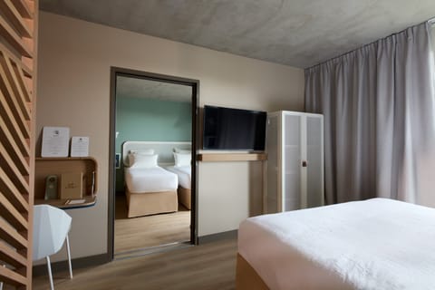 Classic Room including self-service snacks and drinks at the Club | In-room safe, desk, laptop workspace, blackout drapes