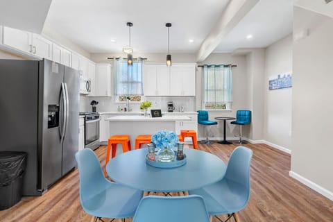 Contemporary kitchen with vibrant pops of color and sleek modern finishes