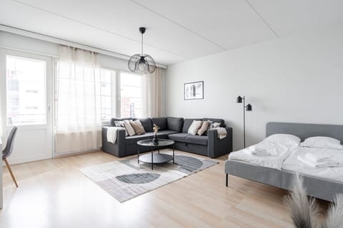 Relax in the spacious living area where the versatile layout comfortably accommodates both lounging and a restful night`s sleep.