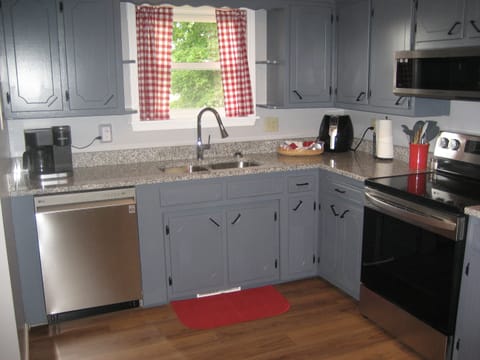 Kitchen with Keurig and pot coffee maker, toaster, can opener, and air fryer