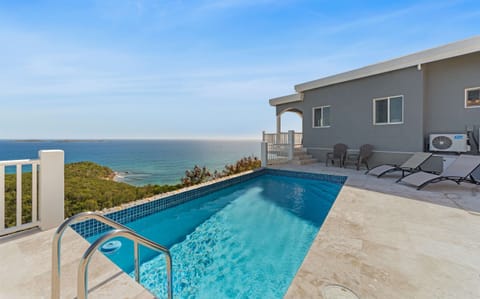 Take a refreshing dip in your private pool overlooking the hillside.