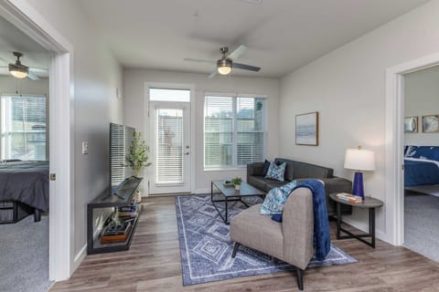 Bright and inviting living space with modern décor, a smart TV, and plenty of natural light—perfect for relaxing after a day of exploring!