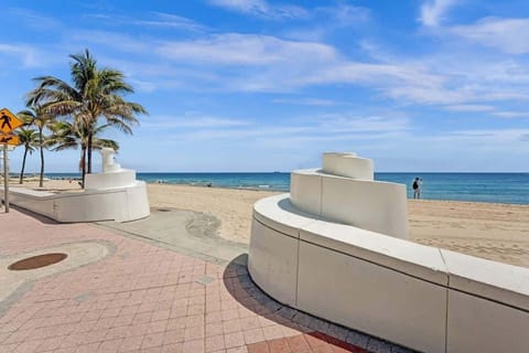Beachfront promenade and open ocean just a short walk away.