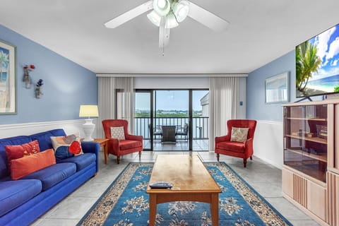 Living Room with Balcony Access and Water Views