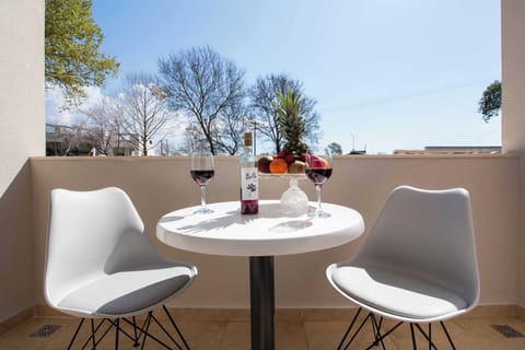 Sunny Getaway Balcony – A cheerful spot for coffee, sunshine, and sea breeze.