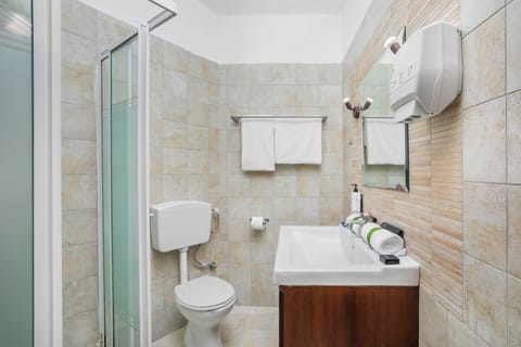 Standard Double Room | Bathroom | Shower, hair dryer, towels, soap