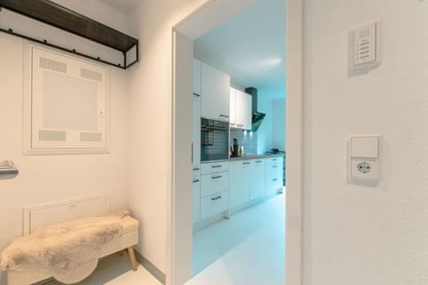 A view from the hallway into the kitchen.