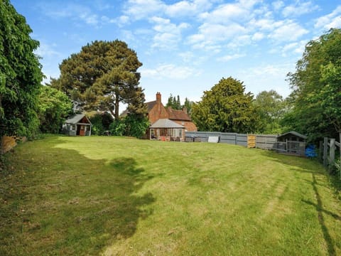 Expansive lawn surrounded by trees for privacy