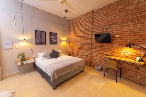 Deluxe Triple Room | Desk, laptop workspace, iron/ironing board, free WiFi