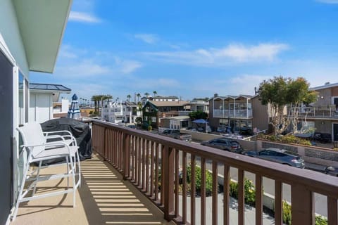 Balcony off living and dining area with beach views