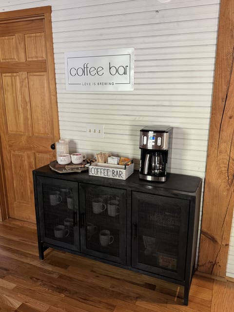 Fully stocked coffee bar.  Ground coffee, sugar, and creamer.