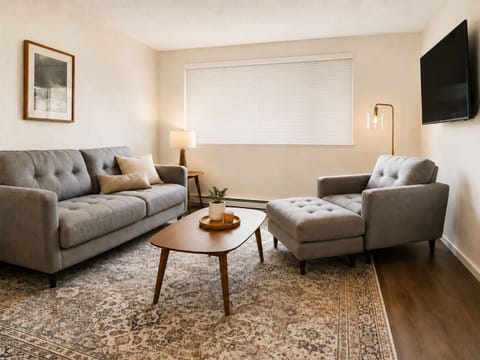 Comfortable living room with spacious seating, TV