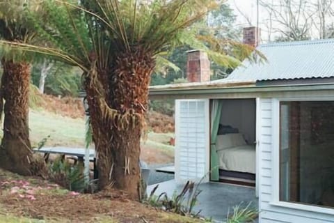 Master bedroom with French doors opening to the back patio.