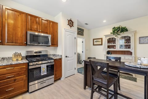 A dining table for two sits in the kitchen