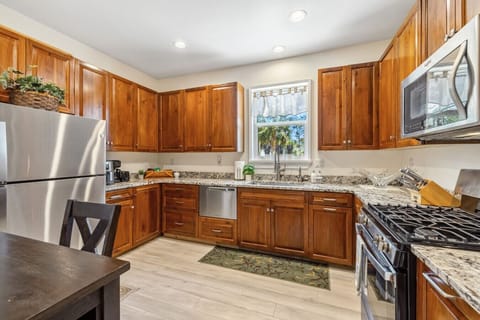 Large fully stocked kitchen with gas stove