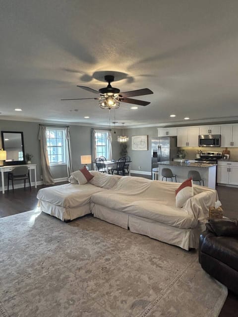 This open-concept living room and kitchen is perfect for entertaining and keeping company, with plenty of space to relax and enjoy time together.