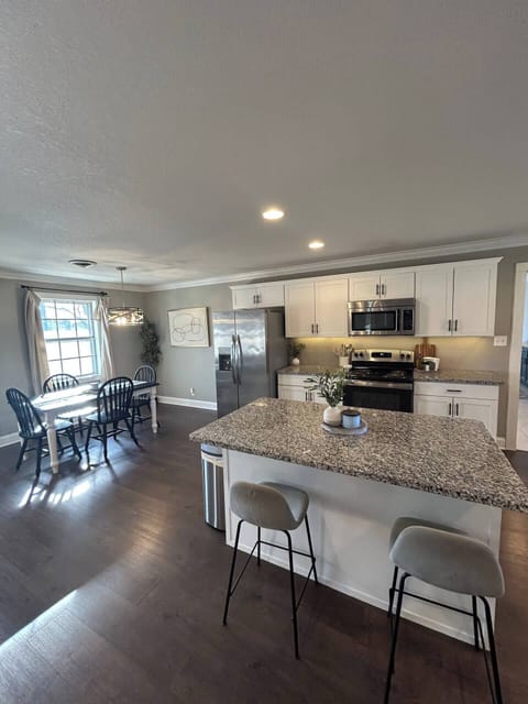 Enjoy the spacious open-concept dining and kitchen area, ideal for meals and gatherings.