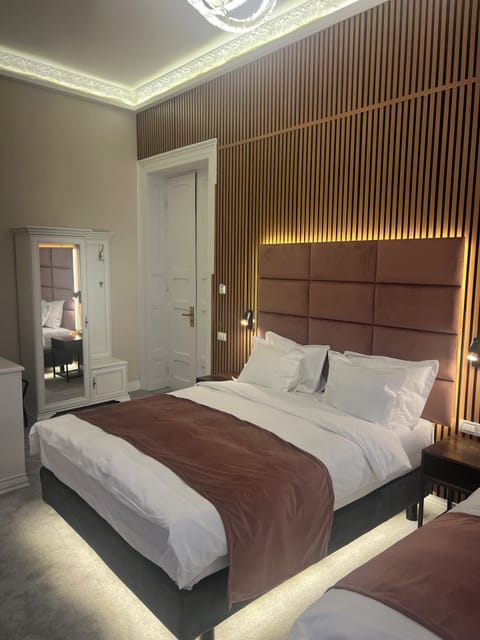 Deluxe Triple Room, City View | In-room safe, blackout drapes, soundproofing, iron/ironing board