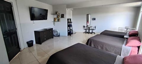 Comfort Room, Multiple Beds, Housekeeping | Desk, laptop workspace, free WiFi