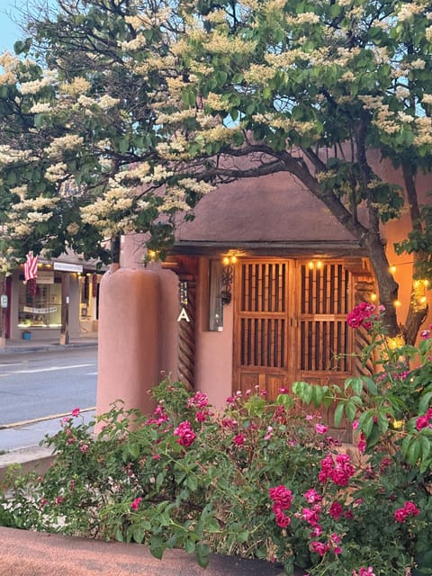 Historic adobe entrance, steps from the Plaza
