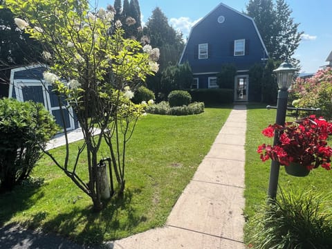 Front Yard, spacious driveway, Crooked Lake located behind the house.