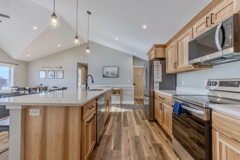 Fully stocked open concept kitchen with an island that seats six!