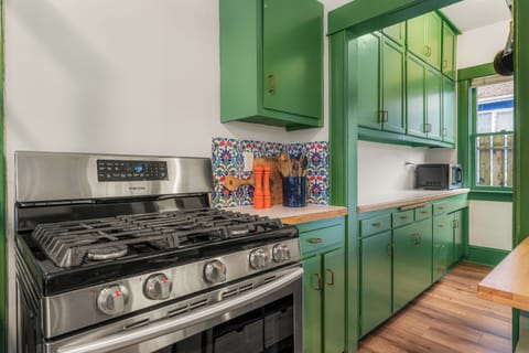 Cook with ease on the gas range, fully stocked with essential utensils.