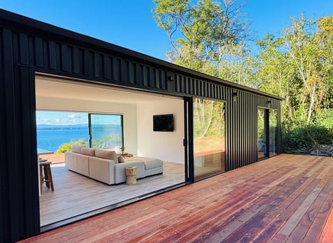Back Deck with views over the lake.  Outdoor table & seating for eight on deck.