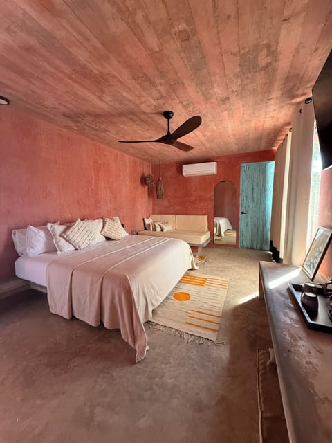 Deluxe Triple Room, Partial Ocean View | Minibar, in-room safe, free WiFi, bed sheets