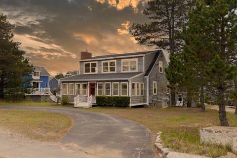 Welcome to Salt & Cedar - twilight edition! This home has two driveways, one pictured here and the other out behind the property
