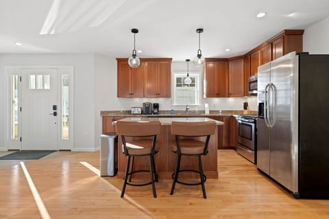 Fully equipped kitchen with all necessary utensils with updated appliances. Open concept kitchen and dining area. Seating for 2 at the island